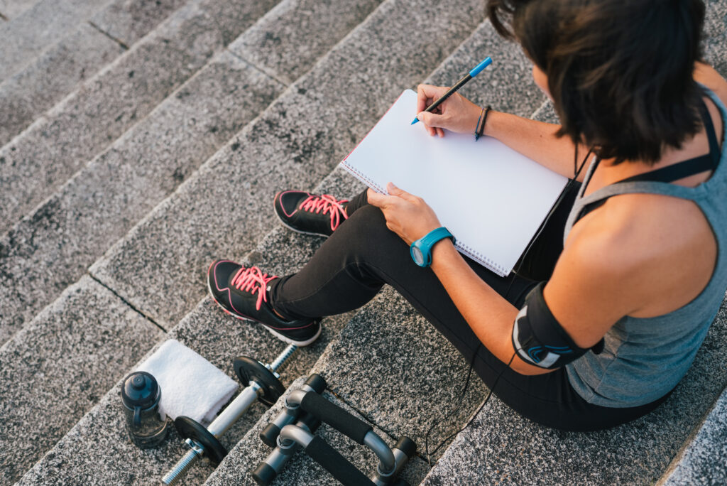 Woman creating workout routine