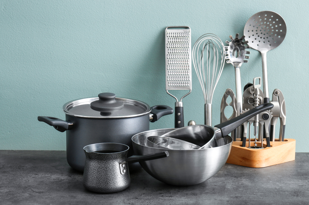 Metal cooking utensils on table