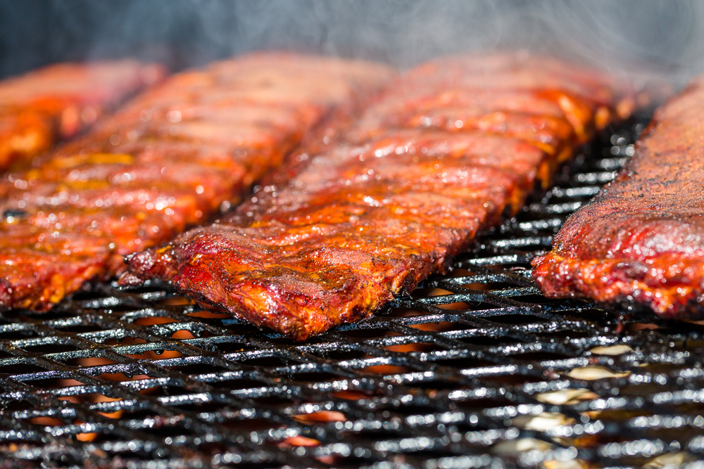 Baby back ribs prepared in smoker.